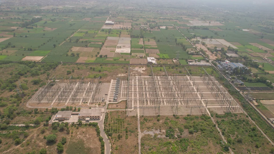Aerial view of a grid station within an agricultural landscape