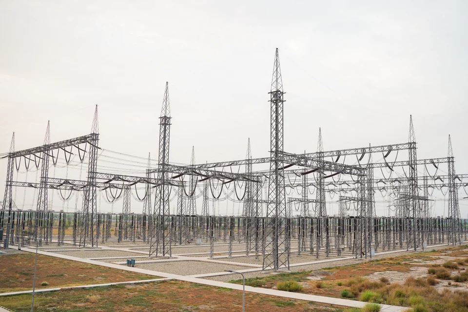 Gantries, conductors and paved routes inside an open-air substation
